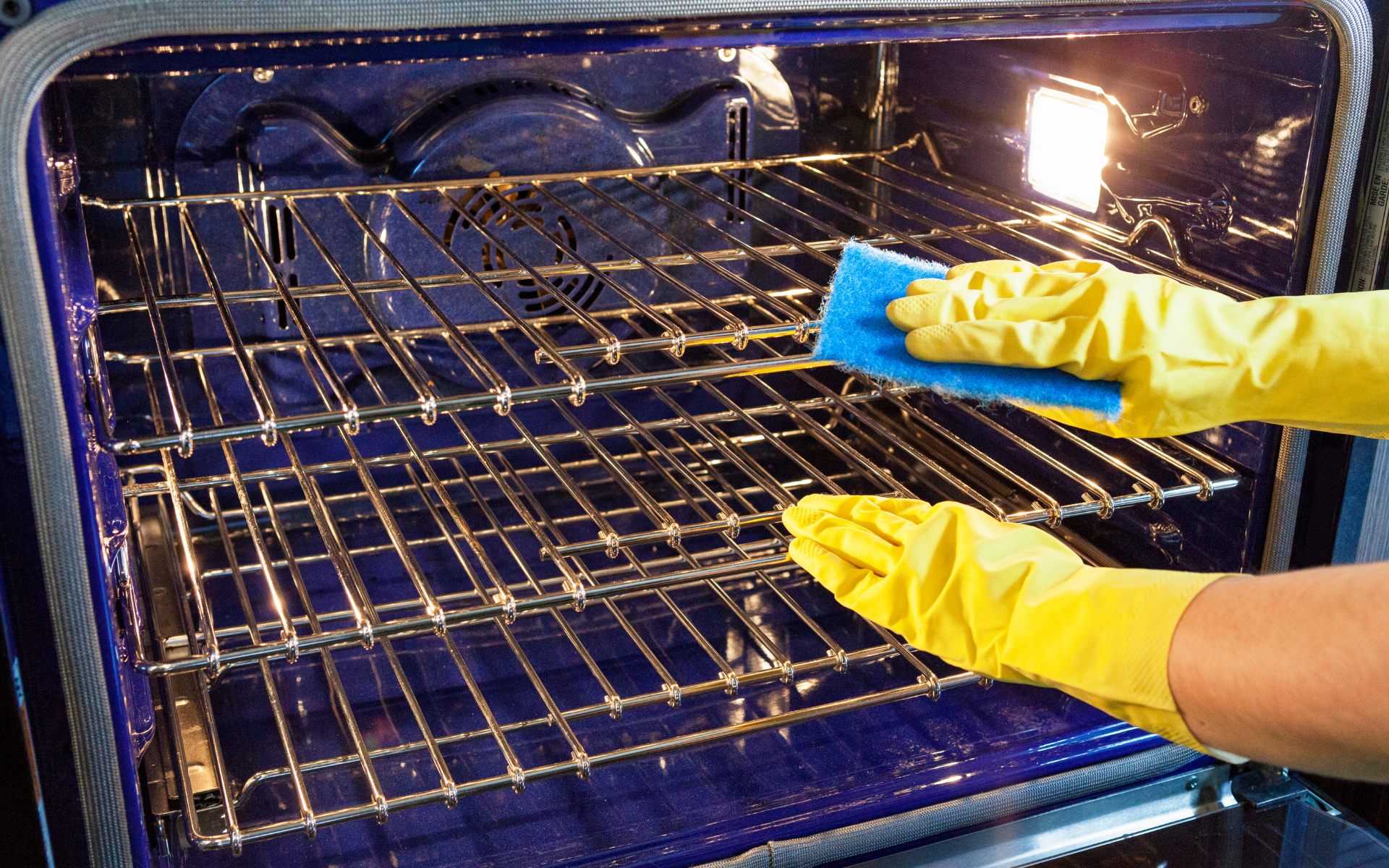 Maid cleaning the over racks