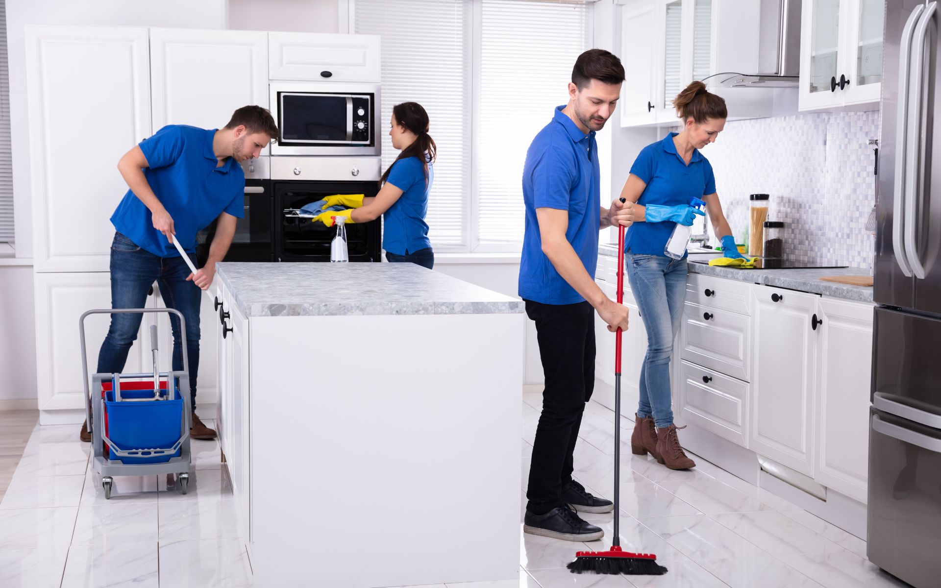 4 maids cleaning the kitchen