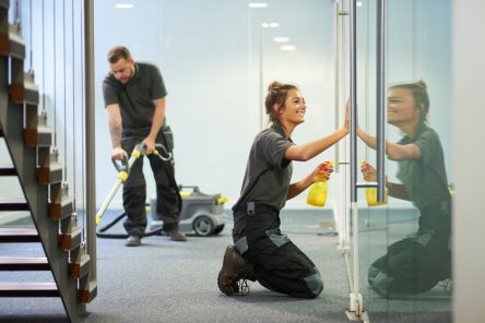 2 maids cleaning an office for commercial cleaning prices